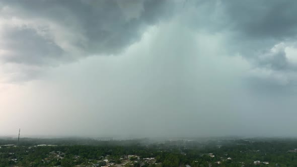 Landscape of Dark Ominous Clouds Forming on Stormy Sky Before Heavy Thunderstorm Over Rural Town