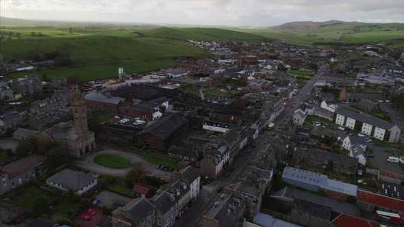 Flying over Longrow Campbeltown Scotland with view of church