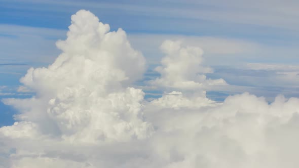 The View From the Window of the Plane on the Beautiful Clouds