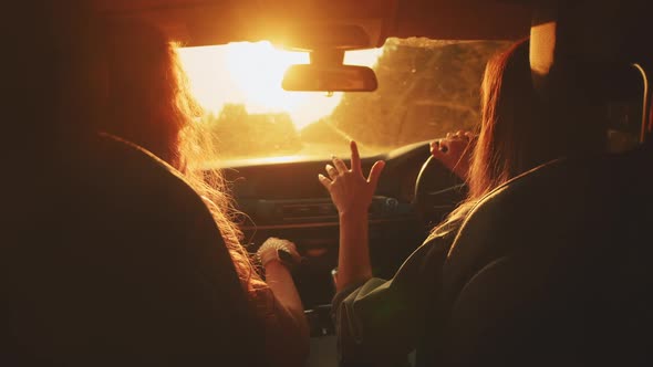 Two Happy Female Woman Friends Enjoy Travel in Car