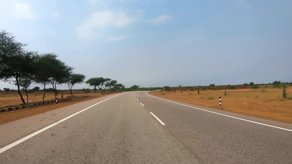 Driving a Car on a Road in Rajasthan India