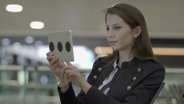 Young Attractive Woman Using Digital Tablet Browsing the Web