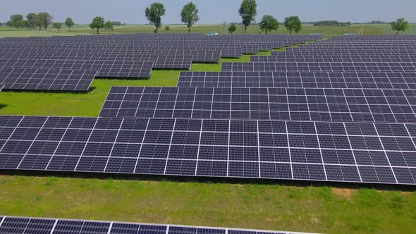 Solar Panels in Green Field Aerial View
