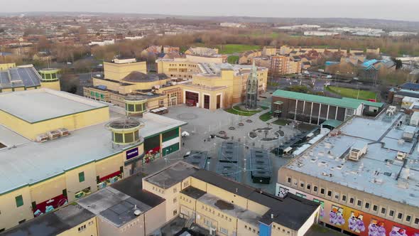 Aerial view appraoching Basildon Town Centre, Library and St Martins Church in the morning