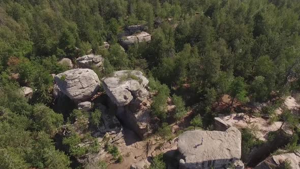 Stone Town. Huge stones in the forest. Aerial. Russia, Perm region 08