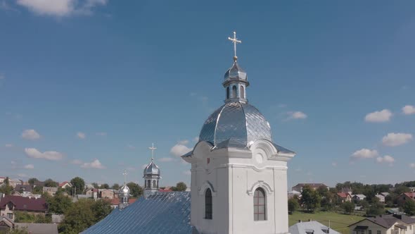 Dome of church, Aerial view, Traditional old church in Ukraine small village, Blue sky background