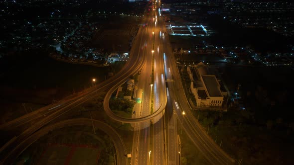 4K : Time lapse Aerial view and top view of traffic on city. Expressway with car lots