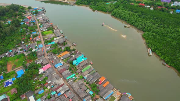 Aerial Shot of Local Fisherman Village Beside the sea.