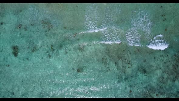 Aerial landscape of exotic coast beach adventure by blue sea and white sandy background of a dayout 