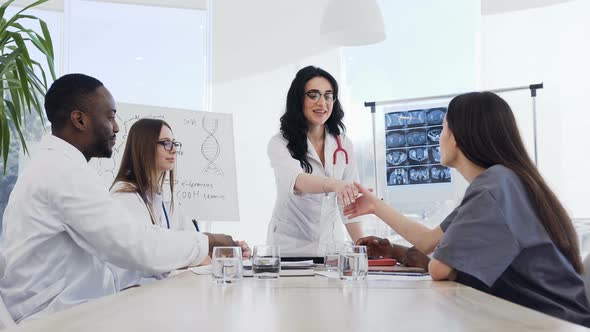 A Young Medical Staff Applauding to Female Doctor After Interesting Lecture