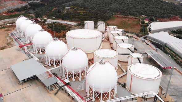 Huge spherical gas tanks in industrial complex. Fuel factory tanks with storage.