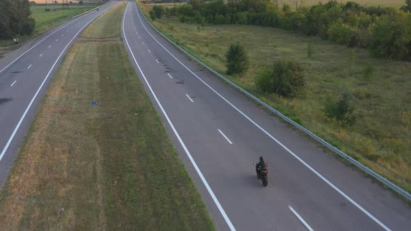 Aerial Shot of Man Riding on Modern Sport Motorbike at Highway