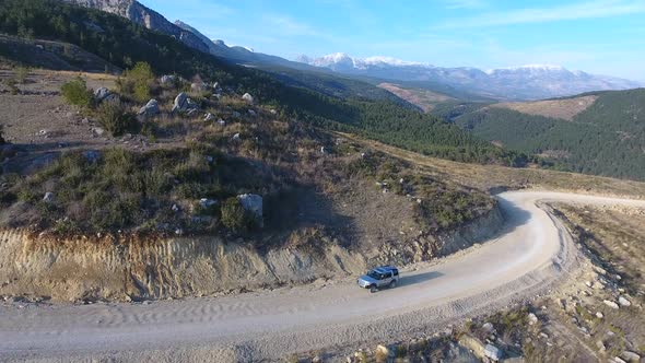 4X4 Suv Car Uphill Going the Wooded Mountain Road