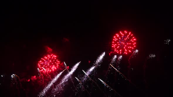 Spectacular Fireworks Display with Confetti on Night Sky