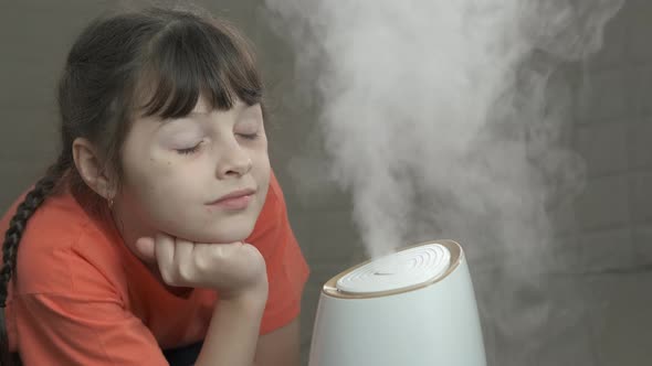 Child with Humidifier Applience in Room