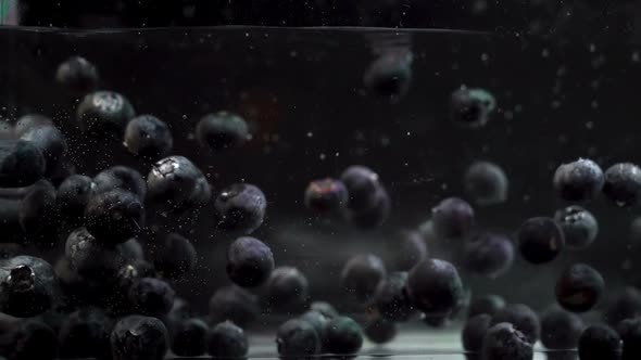 Blueberries Creating Bubbles While Floating in A Fluid