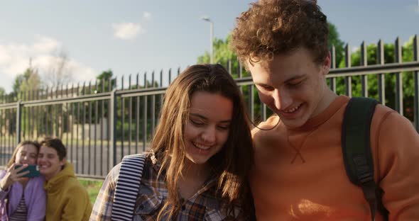 Teenagers hanging out in their school grounds