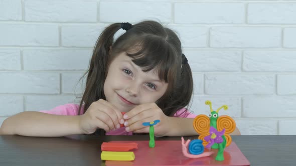 With plasticine at home.  alt