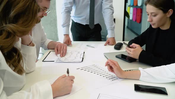 Close Up Hands of Creative Employee Standing and Brainstorming Stategy Plan in Happy Workshop at