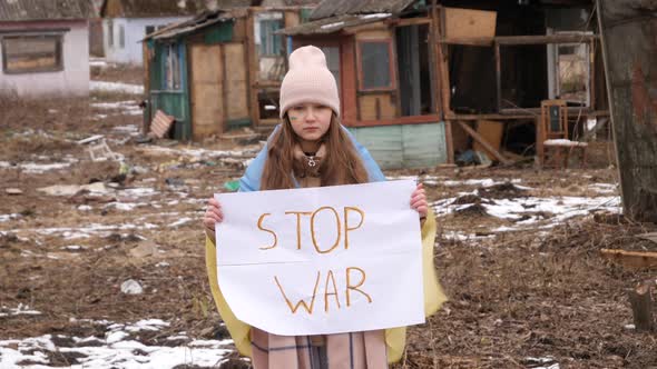 Upset Ukrainian poor girl kid protesting war conflict raises banner with inscription massage text St