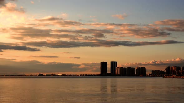 Cityscape Buildings And Clouds In The Afternoon