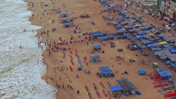 Aerial view of a crowded beach in India, Puri, Orissa. 4k