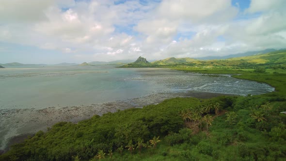 Fijij Travel - Low tide Aerial Drone Flight over Mangroves near the maountains.