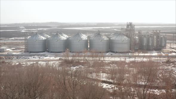 Industrial Elevator on the Background of a Winter Field