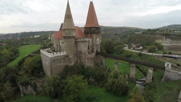 Aerial view of Corvin Castle and its bridge