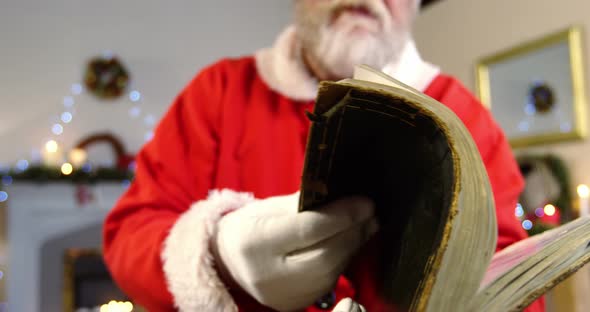 Santa claus reading a list during christmas time 4k