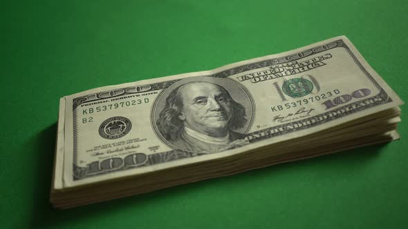 Large Bundle Of 100 Dollar Bills Isolated On Chroma Key Green Screen Background