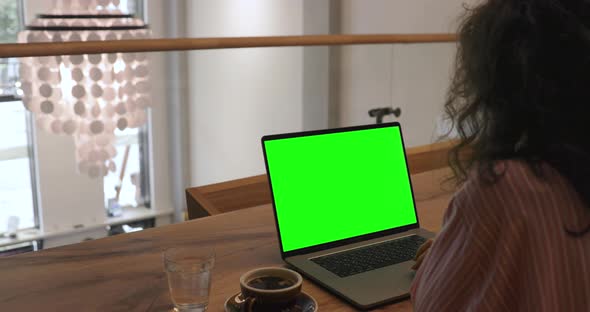 Computer with a mock-up green screen. Digital Art Artist, NFT technology