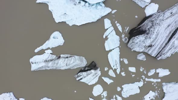 Aerial View of Floating Icebergs and Melting Ice Cap as Result of Global Warming and Climate Change 