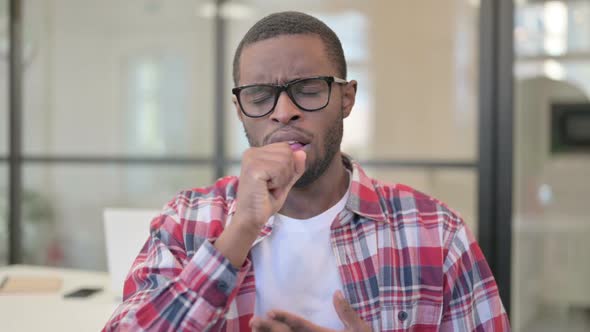 Portrait of Sick African Man Coughing