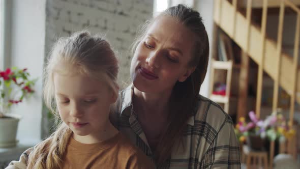 Mother and Girl Have Fun Playing Synthesizer Funny Melodies