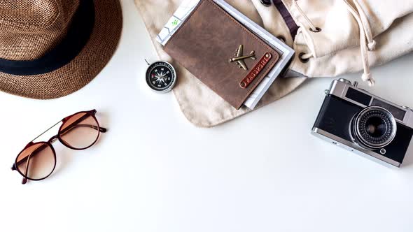 Stop motion of travel accessories and items on white background