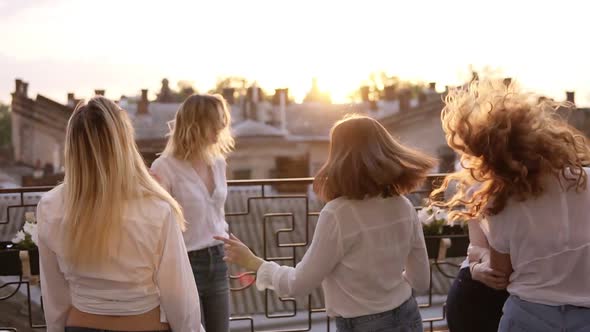 Six Women are Hanging Out Together on the Terrace