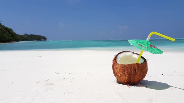 Aerial above travel of tropical seashore beach holiday by transparent sea with white sandy backgroun