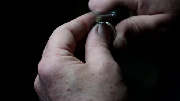 Closeup of Wedding Ring Polishing By Caicasian Jeweler Isolated  Footage