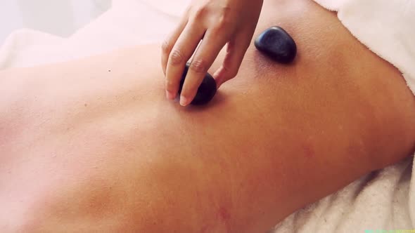 Hot Stone Massage Treatment By Therapist in Spa