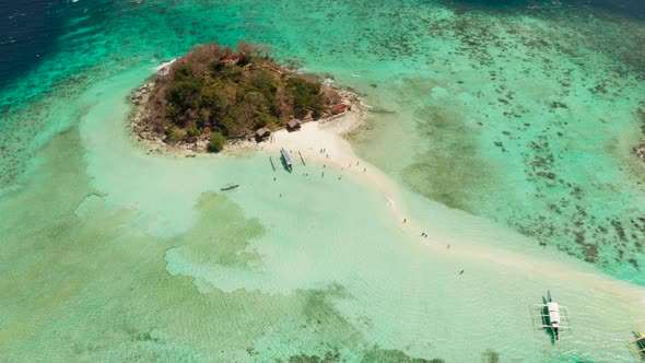 Small Torpic Island with a White Sandy Beach, Top View.