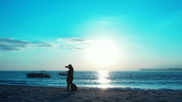 Woman tanning on exotic tourist beach journey by blue water with white sand background of the Maldiv