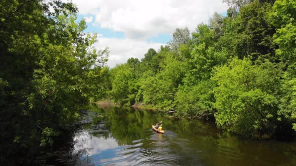 Aerial Drone View of Sport Canoe on Summer Calm Forest River
