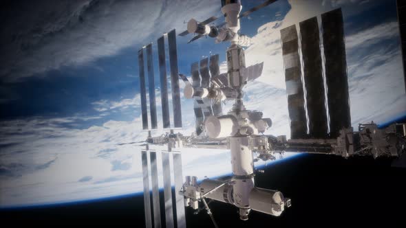 A View of the Earth and a Spaceship. ISS Is Orbiting the Earth alt