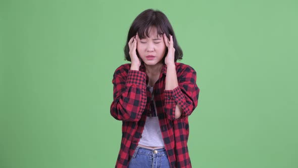 Stressed Asian Hipster Woman Having Headache