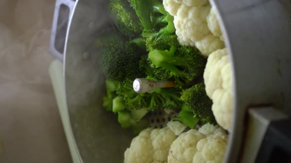 Vertical Shot Of Steamed Broccoli And Cauliflower. Close Up