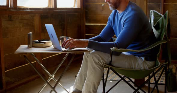 Man Using Laptop at Home 