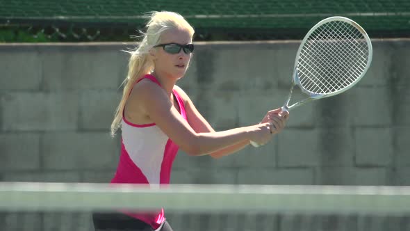 Women playing tennis.