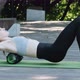 Girl on Yoga Mat Does Back Massage with an MFR Roller - VideoHive Item for Sale