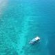 Tropical island, boat in turquoise water over beautiful coral reef, aerial - VideoHive Item for Sale